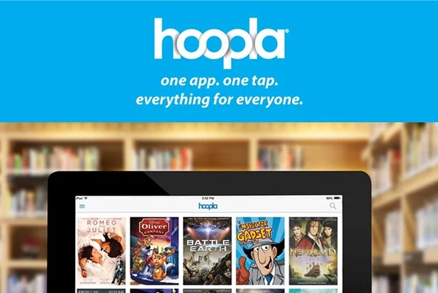 Hoopla logo. Underneath are two hands holding a tablet that has books and movies and music on it